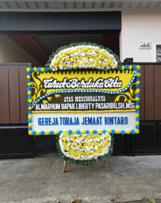 Papan Bunga Duka di Wanajaya